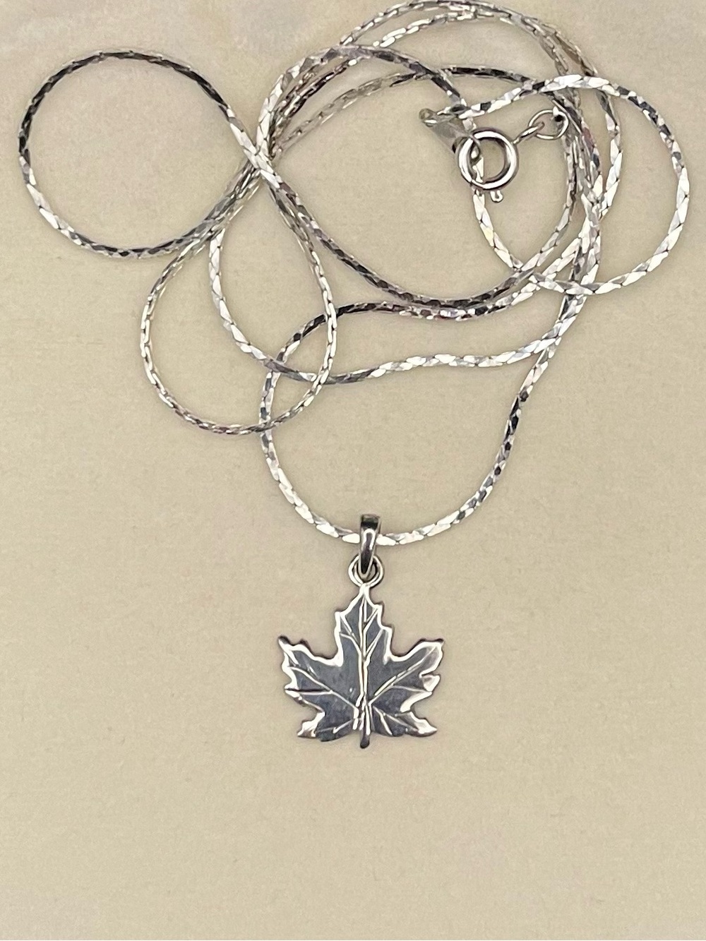 NWOT 925 SS Maple Leaf Pendant with 24” chain necklace . Weighs 4.51g